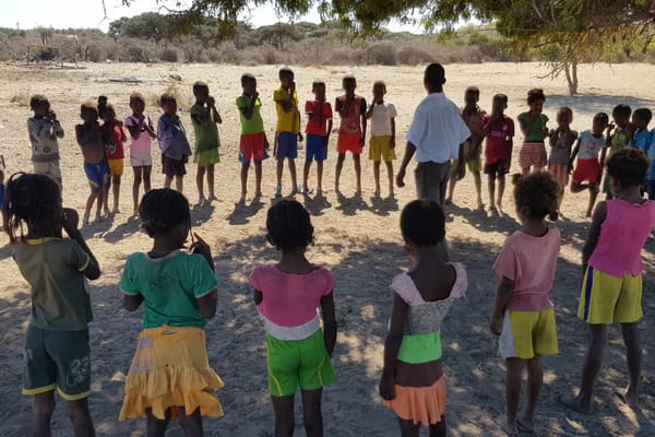 Children standing in a circle in Madagascar